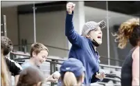  ?? MICHAEL AINSWORTH — THE ASSOCIATED PRESS ?? A fan reacts to having a foul ball land in her cup of soda during a preseason game between the Rangers and Brewers on Tuesday in Arlington, Texas.