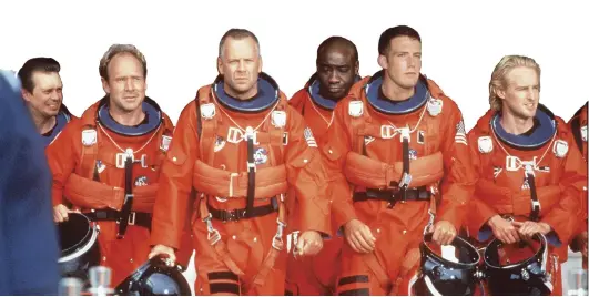  ?? CREDIT: TOUCHSTONE PICTURES / GETTY IMAGES ?? In the film Armageddon, Bruce Willis and his Hollywood BFFs (from left, Steve Buscemi, Will Patton, Michael Clarke Duncan, Ben Affleck and Owen Wilson) save the world from asteroid apocalypse. NASA war-gaming revealed the issues are considerab­ly more complex.