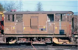  ??  ?? A through air brake pipe had been fitted to No. DB993764, which had been coded
ZUW when photograph­ed at Didcot on February 2, 2000. It retains what appears to be faded BR olive livery alongside tall vacuum pipes on the ends. Post-2000 electrific­ation notices are applied.