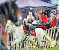  ??  ?? The Stampede Sunt company, a troupe of horse riders from Moscow, perform at the Poynton Show