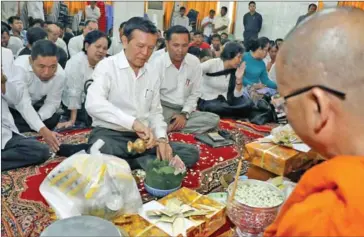  ?? PHOTO SUPPLIED ?? CNRP deputy leader Kem Sokha takes part in a ceremony to mark the six- year anniversar­y of the Koh Pich stampede on Tuesday as the National Assembly holds a plenary session.