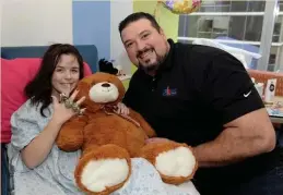  ?? GETTY IMAGES FILE ?? ‘JUST THE WAY HE FUNCTIONS’: Joe Andruzzi visits Kaitlyn at Boston Children’s Hospital in 2016.