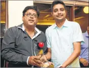  ??  ?? Railways Kamal Chawla (right) receives the ‘Champions Trophy’ and cheque of Rs 30,000 from former World Billiards champion Ashok Shandilya. Chawla defeated Rohan Jambusaria in the final of the Bombay Gymkhana Handicap Billiards Tournament.