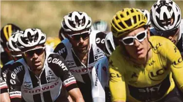  ?? AFP PIC ?? Geraint Thomas (right) and Tom Dumoulin (left) race during the 14th stage of the Tour de France on Saturday.