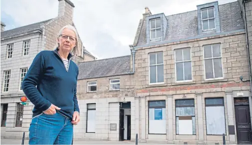  ??  ?? CONCERNED: Councillor Moira Ingleby, in front of the closed Huntly branch of RBS, is worried about elderly people’s access to banking