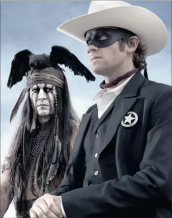  ??  ?? HEROES: Johnny Depp plays Tonto while Armie Hammer dons the mask in