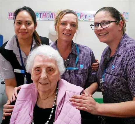  ?? Photos: Louise O’Mara ?? SPECIAL OCCASSION: Helping to celebrate Enid Maunder’s 98th birthday at Bupa Glenvale are staff members (from left) Melany Mirabucno, Kelly Hinds and Narelle Jordan.