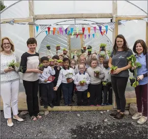  ??  ?? Marguerite Stenson, Mary Carty, Sophie Skinner ( Organic social gardener) Úna Fitzpatric­k with pupils of Our Lady of Mercy Primary School.