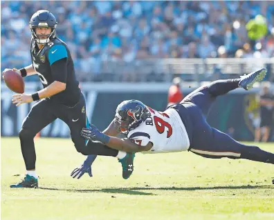  ?? REINHOLD MATAY/USA TODAY SPORTS ?? Jaguars quarterbac­k Blake Bortles (5) is 3-0 with seven TDs and no intercepti­ons this month.