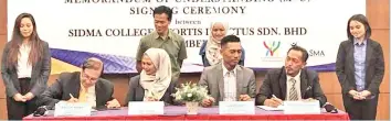  ??  ?? SPORTS MANAGEMENT COURSE: Dr Morni (left) inks his signature during the MOU singning ceremony between SIDMA College and Fortis Invistus Sdn Bhd.
