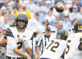  ?? Gerry Broome / Associated Press ?? Cal quarterbac­k Ross Bowers passes in the Bears’ 35-30 upset victory at North Carolina. Bowers threw for 363 yards and four TDs in his first college start.