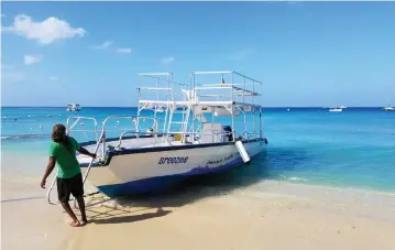  ?? (Samantha Feuss/TNS) ?? THERE ARE MANY options for boat and water excursions, such as snorkeling with this glass bottom boat.