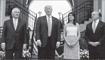  ??  ?? Trump speaks to reporters after meeting with Tillerson (left), Haley (second right) and National Security Adviser HR McMaster (right) at Trump’s golf estate in Bedminster, New Jersey. — Reuters photo