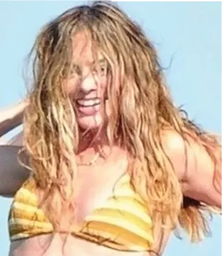  ?? ?? coiffed actress Margot Robbie let her hair down in Formentera