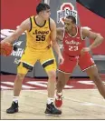  ?? Jay Laprete / Associated Press Iowa's Luka Garza, left, posts up against Ohio State's Zed Key in the first half Sunday. ??