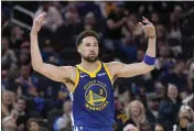  ?? THEARON W. HENDERSON — GETTY IMAGES ?? The Warriors’ Klay Thompson (11) reacts during the fourth quarter against the Rockets at Chase Center on Friday.