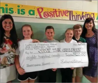  ?? BARBARA ORMSBY - DIGITAL FIRST MEDIA ?? Students and staff from Lakeview Elementary School in Ridley Park show off the check with the money they raised for Hurricane Harvey victims. Pictured, left to right, are Principal Gloria Goldey, Leadership Team students members Nikki Naumowich, Chris...