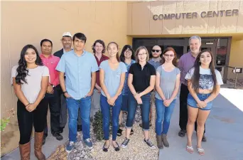  ?? COURTESY OF NMSU ?? Students from New Mexico State University’s Cyber Infrastruc­ture Training and Mentoring internship program stand in front of the university’s computer center. The program recently won a $460K grant.