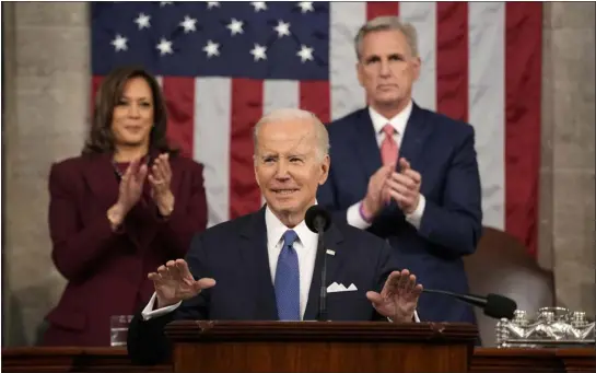  ?? JACQUELYN MARTIN — THE ASSOCIATED PRESS ?? President Joe Biden, foreground, delivers the State of the Union address to a joint session of Congress at the U.S. Capitol on Tuesday in Washington as Vice President Kamala Harris, left, and House Speaker Kevin Mccarthy of Calif. applaud.