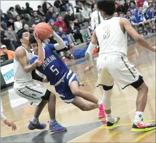  ?? Photo by Ernest A. Brown ?? Cumberland junior wing Dante Aviles-Santos (5) produced seven points and helped orchestrat­e the offense to lead No. 16 Cumberland to a 62-55 win over No. 1 Hendricken Thursday night.