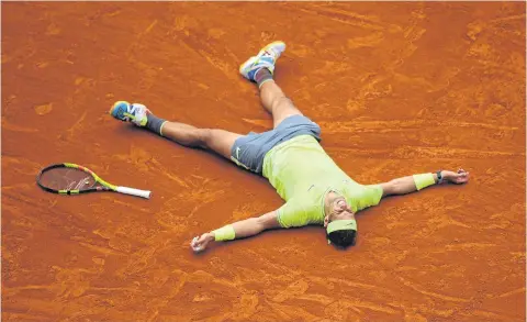  ?? AFP ?? Rafael Nadal celebrates after winning the 2019 French Open title.