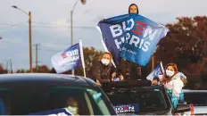  ?? New York Times ?? Supporters of Joe Biden at a campaign rally in Detroit. Biden urged voters to vote without delay.