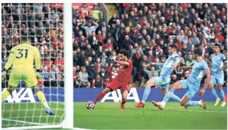  ?? AP ?? On target:
Liverpool's Mohamed Salah scores his side's second goal during the English Premier League match between Liverpool and Manchester City at Anfield.