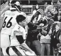  ?? JOSHUA GUNTER/CLEVELAND.COM VIA AP ?? The Browns’ Myles Garrett hits Steelers QB Mason Rudolph with a helmet Thursday.