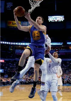  ??  ?? Denver Nuggets’ Gary Harris (left) goes up for a shot as the Houston Rockets’ Clint Capela defends in their NBA game on Monday. Right: Golden State Warriors’ Klay Thompson shoots in front of Oklahoma City’s Taj Gibson at Oklahoma City.