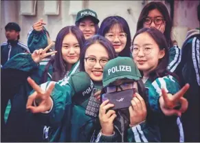  ?? FANG SHICHENG / FOR CHINA DAILY ?? Students clad in greens celebrate St Patrick’s Day at the Beijing Dublin Internatio­nal College of the Beijing University of Technology.