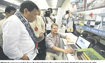  ??  ?? THE Dutch environmen­talist shows President Duterte the scale model of the Profitable Sanitation Facility.