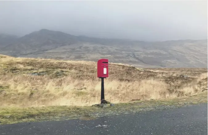  ??  ?? 0 Scotsman journalist Shân Ross took this photograph on Burns Day of a solitary postbox on the road to the ferry at Fionnphort on the Isle of Mull.