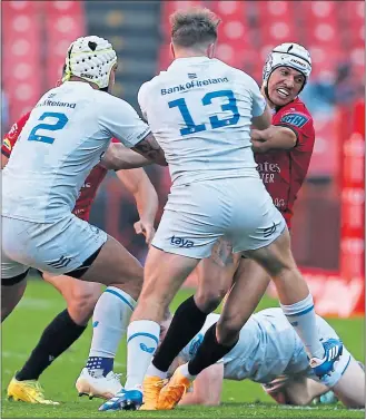  ?? ?? Leinster’s Liam Turner and Cormac Foley attempt to get to grips with the Lions’ Edwill Van der Merwe.