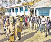  ??  ?? People stand in a queue to cast their votes during re-polling of DDC elections, at a booth in Poonch district on Monday