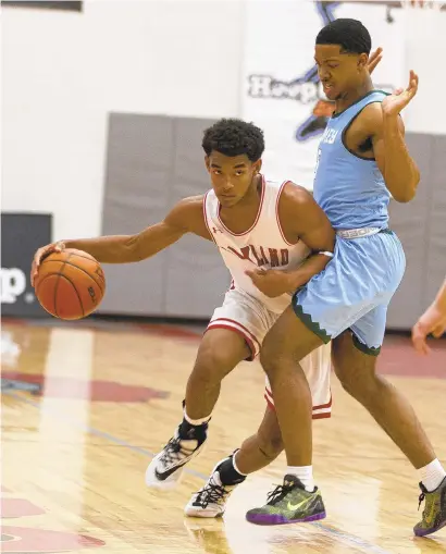  ?? JANE THERESE PHOTOS/SPECIAL TO THE MORNING CALL ?? Parkland’s Trey Rolle moves through Shipley’s Eli Smith during the Lehigh Valley Hoop Group Showcase held Sunday at Parkland High School in South Whitehall Township.