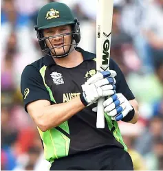  ?? — AFP photo ?? Steve Smith raises his bat after marking his half century (50 runs) during the World T20 cricket tournament match between Australia and Pakistan at The Punjab Cricket Stadium Associatio­n Stadium in Mohali in this March 25, 2016 file photo.