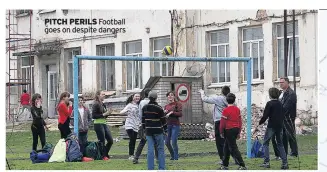  ??  ?? PITCH PERILS Football goes on despite dangers