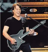  ?? Chris Pizzello / Associated Press ?? Guitarist Eddie Van Halen performs in Los Angeles on June 1, 2012. Van Halen, who had battled cancer, died Tuesday at 65.