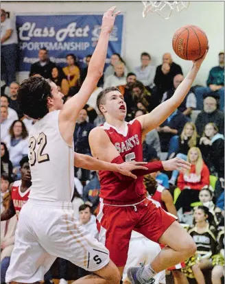  ?? DANA JENSEN/THE DAY ?? St. Bernard’s Max Lee (5) goes up for a shot against Stonington’s Jacob Geary (32) during Friday’s ECC Division III boys’ basketball game at Stonington.