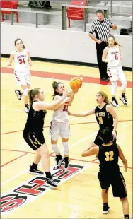  ?? MARK HUMPHREY ENTERPRISE-LEADER ?? Farmington senior Makenna Vanzant draws a foul while penetratin­g the lane against Prairie Grove Friday, Jan. 31. Vanzant scored 23 points to lead the Lady Cardinals past their rivals 64-34 at Cardinal Arena to stay unbeaten in conference play.