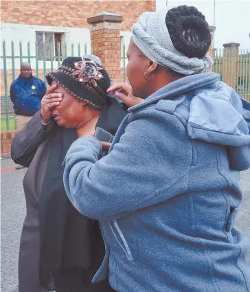  ?? Picture: Alaister Russell ?? TEARS OF RELIEF. Zanokuhle Mbatha’s mother cries as she leaves the Boksburg Magistrate­s’ Court yesterday after her son was released from custody owing to a lack of evidence. Mbatha was accused of being implicated in the murder of footballer Senzo Meyiwa.