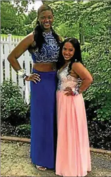  ?? SUBMITTED PHOTO ?? Bianca Roberson, who was 6 feet tall, poses with friend Brittany Mamon before heading off to the senior prom.