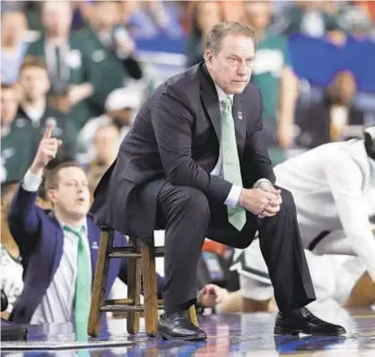  ?? AP ?? Michigan State coach Tom Izzo will instruct his Spartans virtually while in COVID isolation for at least a week.
