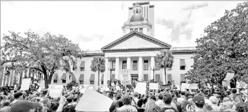  ??  ?? Protestor’s rally outside the Capitol urging Florida lawmakers to reform gun laws, in the wake of last week’s mass shooting at Marjory Stoneman Douglas High School, in Tallahasse­e, Florida, US. — Reuters photo