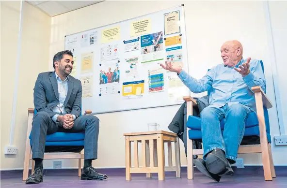  ?? ?? POINT OF NEED: Health Secretary Humza Yousaf, left, meets patient Peter Ward, from Dunfermlin­e, during a visit to Victoria Hospital in Kirkcaldy.