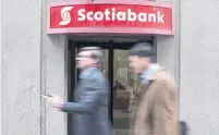  ?? CHRIS YOUNG THE CANADIAN PRESS FILE PHOTO ?? Scotiabank’s net income during the three-month period ended Jan. 31 slipped to $2.25 billion from $2.34 billion a year earlier.