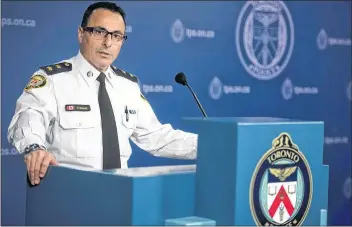  ?? CP PHOTO ?? Insp. Dominic Sinopoli, unit commander of sex crimes, speaks about the alleged assaults and sexual assaults involving students at St. Michael’s College School during a press conference at police headquarte­rs in Toronto on Monday.