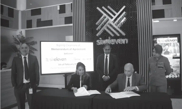  ?? BING GONZALES ?? BANGLADESH Ambassador to the Philippine­s F.M. Borhan Uddin (standing, center) personally witnesses the memorandum of agreement signing between SixEleven Global Services Corp., headed by chairperso­n Joji Ilagan Bian, and Bangladesh-based Aprosoft Consulting and Training headed by CEO Javed Ahmad, for Business Process Outsourcin­g, software developmen­t, education, linkages and other essential collaborat­ions held at SixEleven on Feb. 5, 2024. Also witnessing the event are SixEleven executives William Wijangco, COO, and chief support officer Lovely June Gacho.