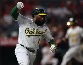  ?? RONALD MARTINEZ — GETTY IMAGES ?? The A’s Josh Harrison reacts after hitting a RBI single against the Angels in the second inning at Angel Stadium of Anaheim on Friday in Anaheim.