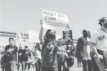  ?? MARISSA LESHNOV/THE NEW YORK TIMES ?? A rally organized by Black and Asian activists gathers in May in San Francisco.